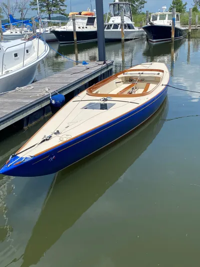 Caprice Yacht Photos Pics 2023 C.W. Hood 32 Daysailer docked in a marina, surrounded by other boats.