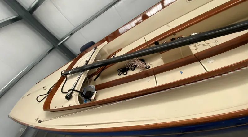 Caprice Yacht Photos Pics 2023 C.W. Hood 32 Daysailer in storage, showcasing sleek design and craftsmanship.