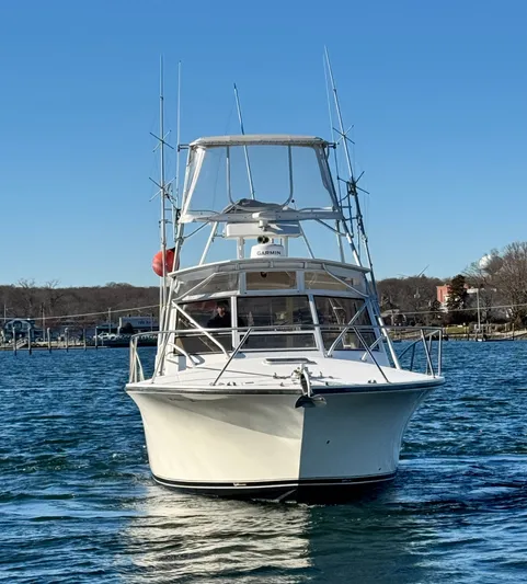 My Turn Yacht Photos Pics 2002 Carolina Classic 35 Express boat on water, front view, clear sky background.