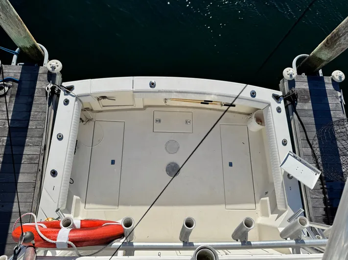 My Turn Yacht Photos Pics 2002 Carolina Classic 35 Express boat docked, aerial view of spacious deck area.