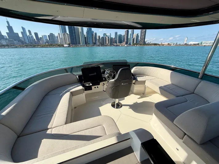 Wild Aces Yacht Photos Pics Luxurious 2022 Absolute 64 Navetta yacht interior with city skyline view.