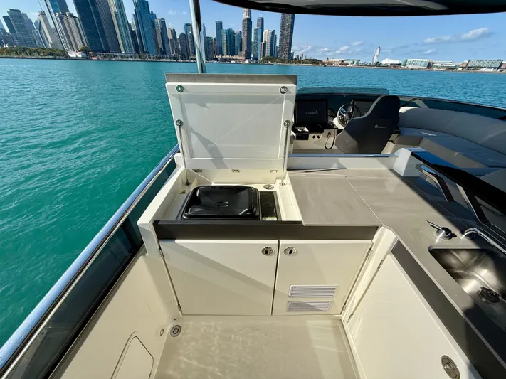 Wild Aces Yacht Photos Pics Luxury Absolute 64 Navetta yacht interior with city skyline view, 2022 model.