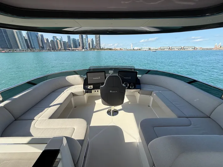 Wild Aces Yacht Photos Pics Luxurious 2022 Absolute 64 Navetta yacht interior with city skyline view.