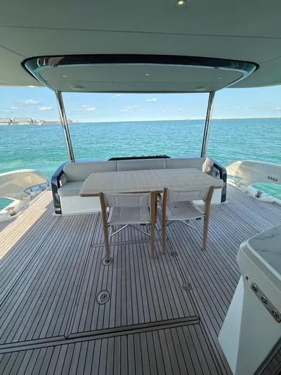 Wild Aces Yacht Photos Pics Luxury deck of 2022 Absolute 64 Navetta yacht with ocean view.