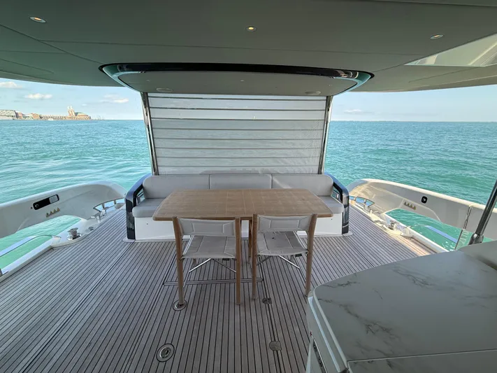 Wild Aces Yacht Photos Pics Luxurious deck of 2022 Absolute 64 Navetta yacht with ocean view.