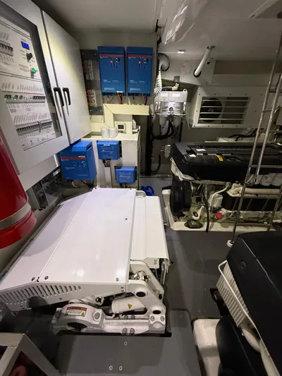 Wild Aces Yacht Photos Pics Engine room of 2022 Absolute 64 Navetta yacht with electrical panels and machinery.