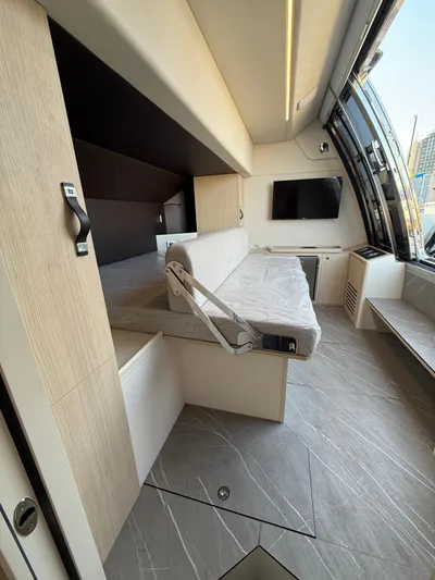 Wild Aces Yacht Photos Pics Interior of 2022 Absolute 64 Navetta yacht with modern design and convertible seating.