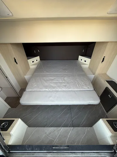 Wild Aces Yacht Photos Pics Luxurious bedroom interior of 2022 Absolute 64 Navetta yacht with modern design and spacious bed.