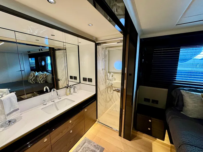 Wild Aces Yacht Photos Pics Luxurious bathroom and bedroom interior of 2022 Absolute 64 Navetta yacht.
