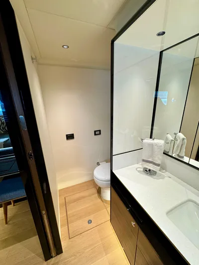 Wild Aces Yacht Photos Pics Luxurious bathroom in 2022 Absolute 64 Navetta yacht with modern fixtures and elegant design.