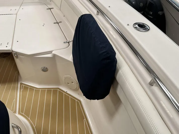  Yacht Photos Pics 2018 Grady-White Canyon 336 boat interior with covered seat and teak flooring.