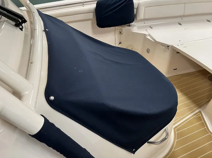  Yacht Photos Pics 2018 Grady-White Canyon 336 boat with navy cover on deck seating area.