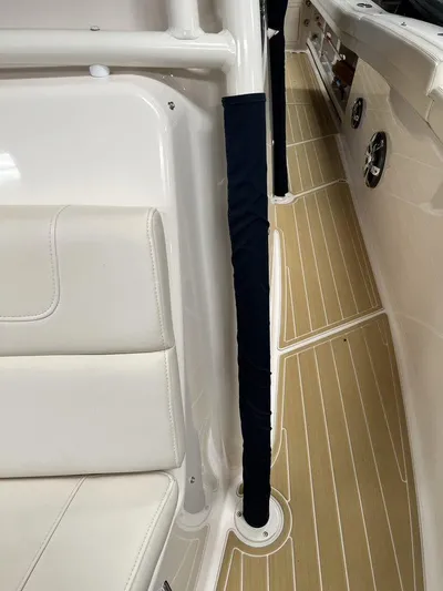  Yacht Photos Pics 2018 Grady-White Canyon 336 boat interior with cushioned seating and teak-style flooring.