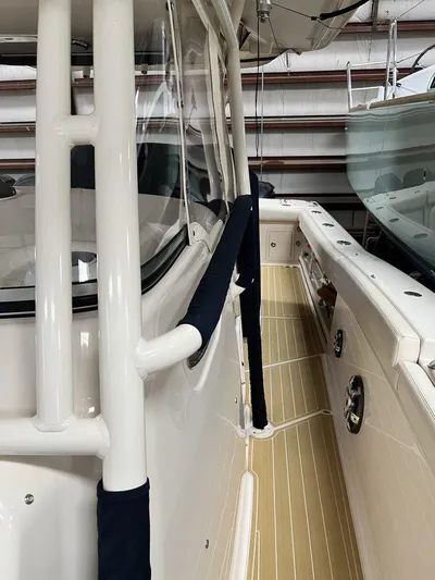  Yacht Photos Pics 2018 Grady-White Canyon 336 boat, side view, showcasing sleek design and deck details.