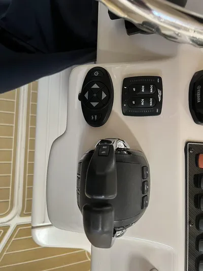  Yacht Photos Pics Control panel of a 2018 Grady-White Canyon 336 boat, featuring joystick and switches.