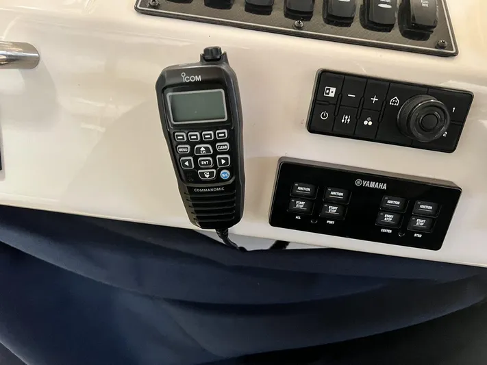  Yacht Photos Pics Control panel of 2018 Grady-White Canyon 336 boat with Icom radio and Yamaha controls.