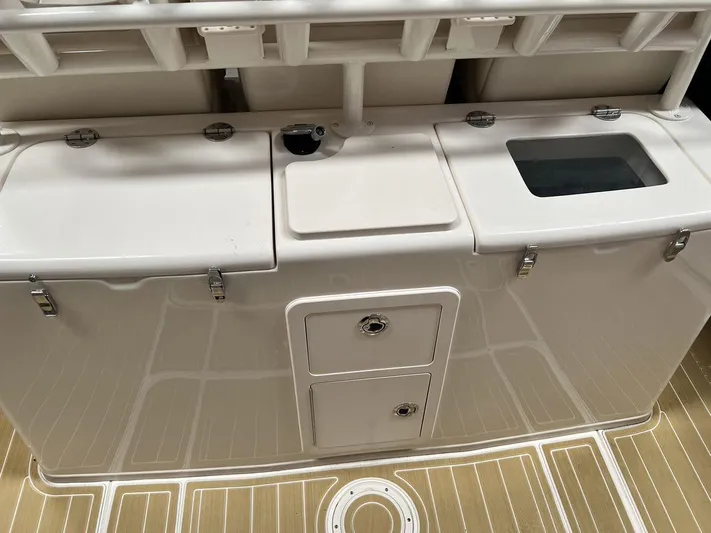  Yacht Photos Pics 2018 Grady-White Canyon 336 boat interior with storage compartments and deck.