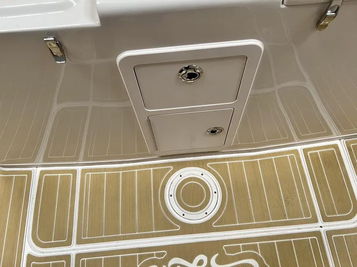  Yacht Photos Pics 2018 Grady-White Canyon 336 boat deck with storage compartments and non-slip flooring.