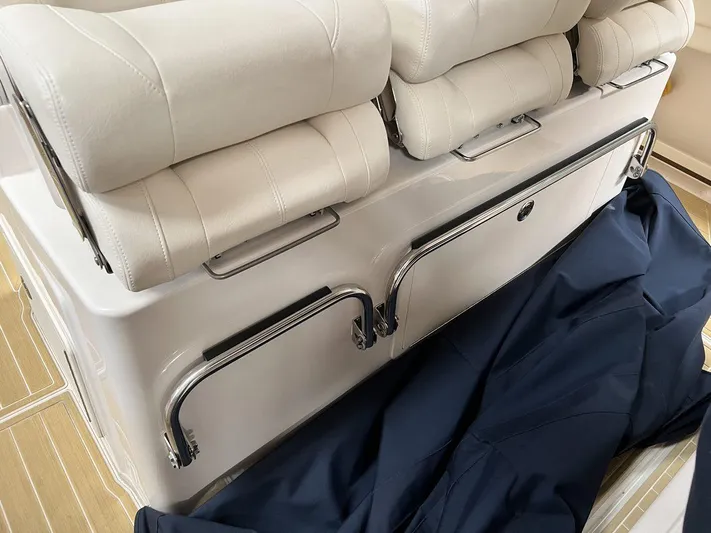  Yacht Photos Pics 2018 Grady-White Canyon 336 boat seating with white cushions and metal railings.