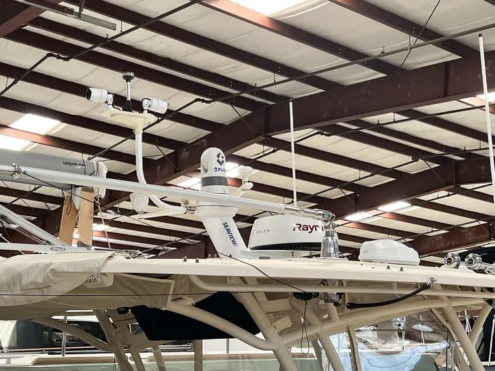  Yacht Photos Pics 2018 Grady-White Canyon 336 boat with radar equipment in a warehouse.