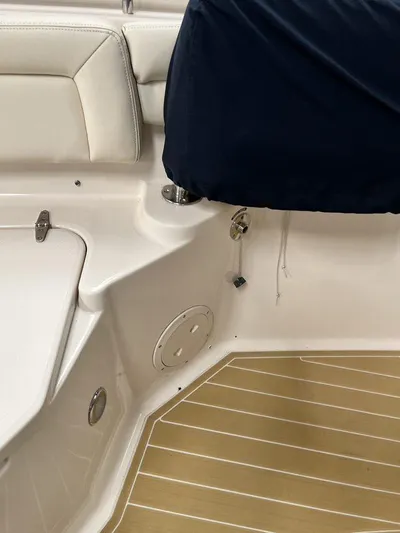  Yacht Photos Pics 2018 Grady-White Canyon 336 boat interior with cushioned seating and covered console.
