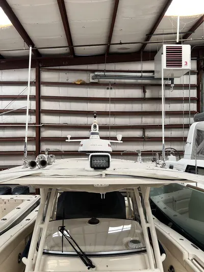  Yacht Photos Pics 2018 Grady-White Canyon 336 boat in storage, showcasing radar and antenna equipment.