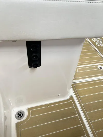  Yacht Photos Pics 2018 Grady-White Canyon 336 boat interior with teak flooring and white seating.