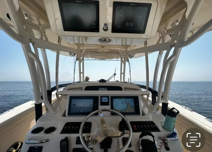  Yacht Photos Pics 2018 Grady-White Canyon 336 helm with advanced navigation systems on open water.
