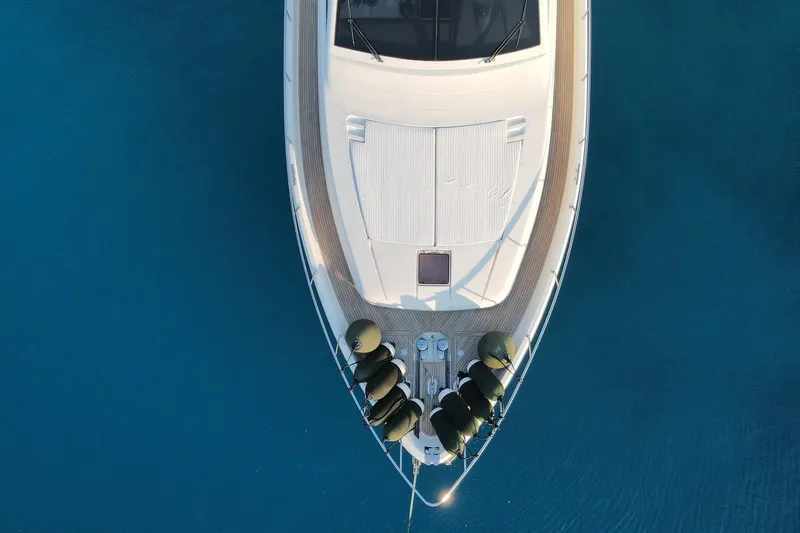 M/y Flow Yacht Photos Pics Aerial view of 2008 Ferretti 681 yacht on clear blue water.