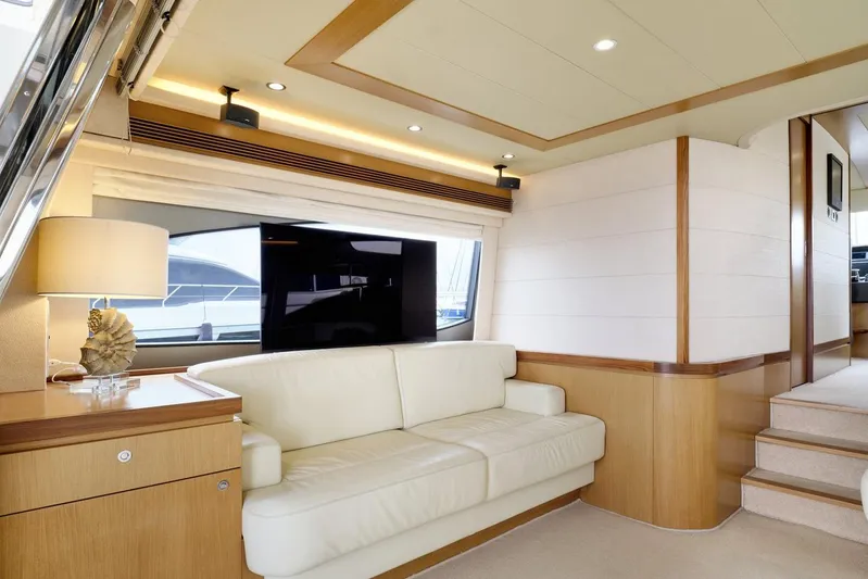 M/y Flow Yacht Photos Pics Luxurious interior of 2008 Ferretti 681 yacht with cream sofa and modern decor.