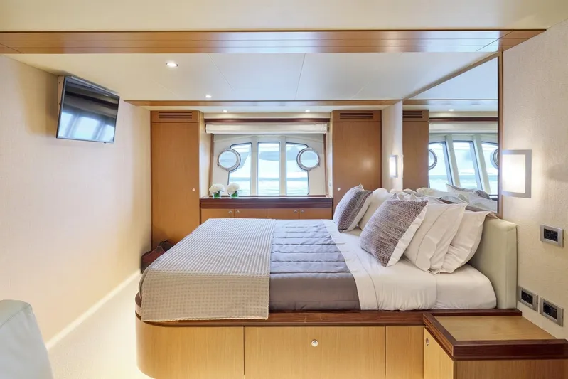 M/y Flow Yacht Photos Pics Luxurious bedroom interior of 2008 Ferretti 681 yacht with modern decor and ocean view.