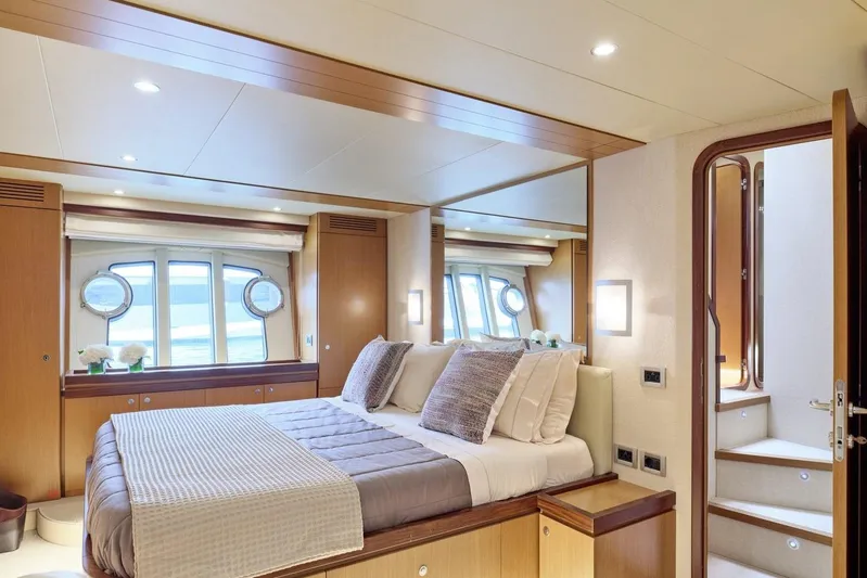 M/y Flow Yacht Photos Pics Luxurious bedroom interior of 2008 Ferretti 681 yacht with elegant decor and natural light.