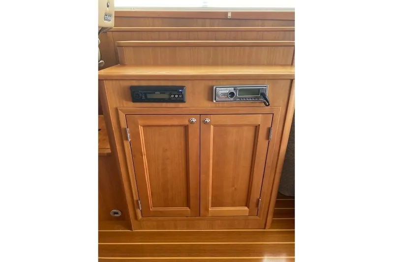  Yacht Photos Pics Wooden cabinet with audio controls on a 2010 Sabre 38 Express boat.