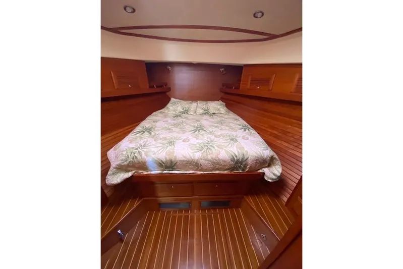  Yacht Photos Pics Luxurious wooden cabin interior of 2010 Sabre 38 Express yacht with cozy bed.