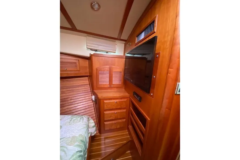  Yacht Photos Pics Interior of 2010 Sabre 38 Express yacht with wooden cabinetry and built-in TV.