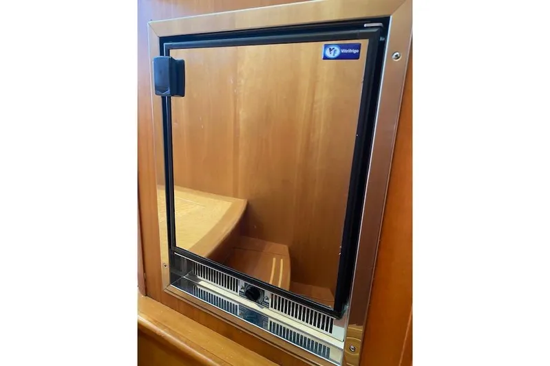  Yacht Photos Pics Built-in fridge on 2010 Sabre 38 Express yacht, featuring a sleek stainless steel design.