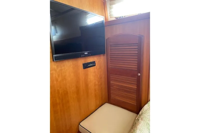  Yacht Photos Pics Interior of 2010 Sabre 38 Express with TV and wooden cabinet.