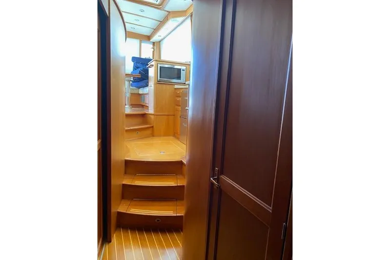  Yacht Photos Pics Interior of 2010 Sabre 38 Express yacht with wooden stairs and cabinetry.