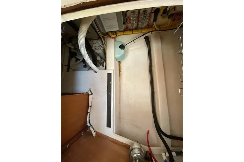  Yacht Photos Pics Engine compartment of a 2010 Sabre 38 Express boat, showing hoses and wiring.