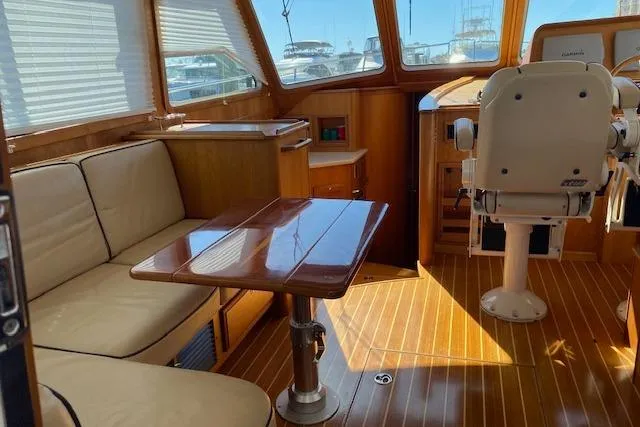  Yacht Photos Pics Interior of 2010 Sabre 40 Sedan yacht with wooden flooring and seating area.