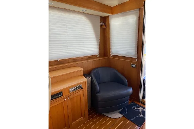  Yacht Photos Pics Interior of 2010 Sabre 40 Sedan with leather chair and wooden cabinetry.