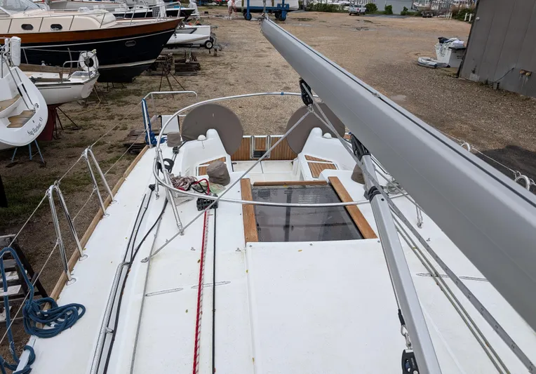  Yacht Photos Pics 2021 Jeanneau Sun Odyssey 349 sailboat on land, showcasing deck and rigging.