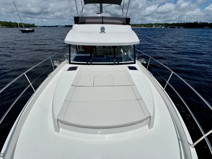 Yacht Photos Pics 2025 Beneteau Swift Trawler 41 Fly on water, showcasing spacious deck and sleek design.