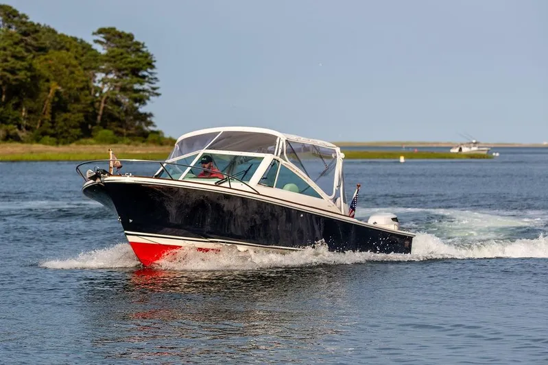 Given To Fly Yacht Photos Pics 2021 Hunt Yachts Harrier 26 cruising on a serene waterway.