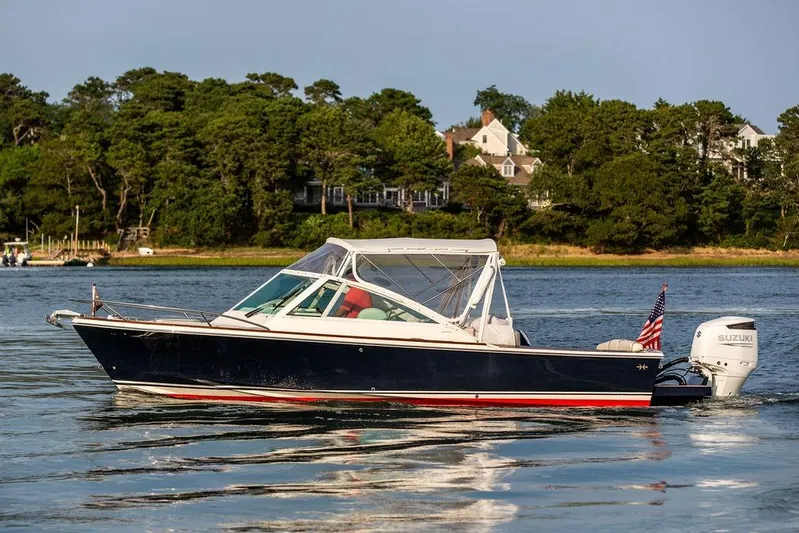Given To Fly Yacht Photos Pics 2021 Hunt Yachts Harrier 26 boat on calm water, with scenic background.
