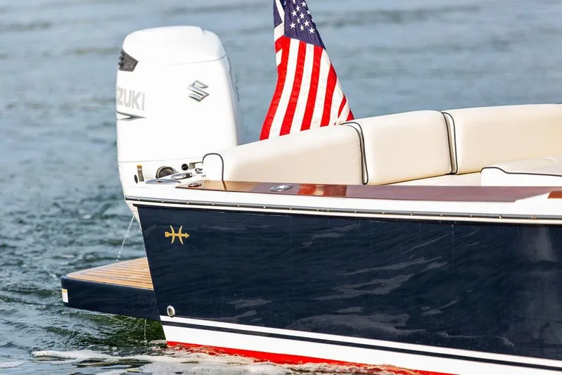Given To Fly Yacht Photos Pics 2021 Hunt Yachts Harrier 26 with Suzuki engine and American flag on water.