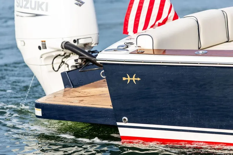Given To Fly Yacht Photos Pics 2021 Hunt Yachts Harrier 26 with Suzuki engine and American flag on water.
