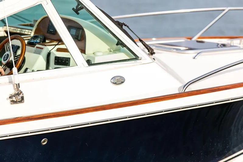 Given To Fly Yacht Photos Pics 2021 Hunt Yachts Harrier 26 boat, featuring sleek design and modern dashboard controls.