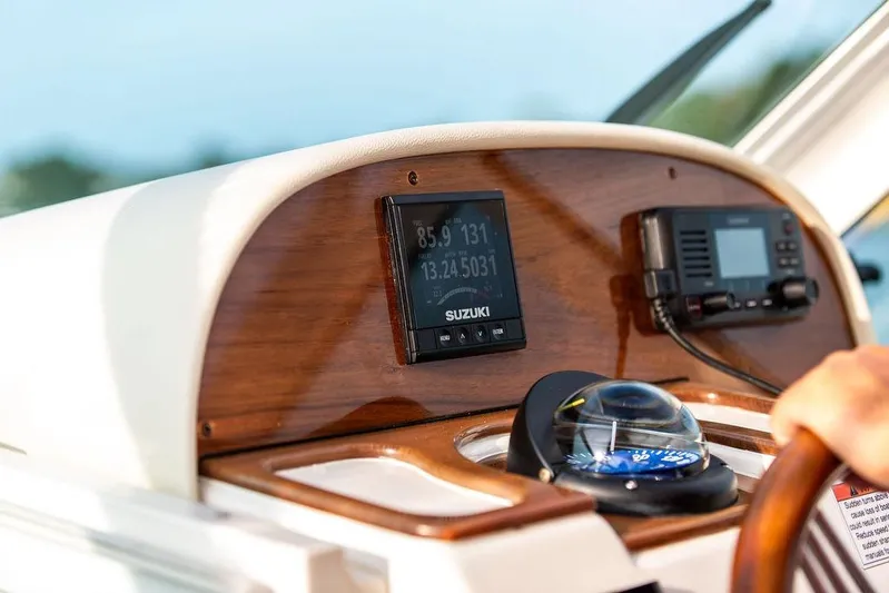 Given To Fly Yacht Photos Pics Helm of 2021 Hunt Yachts Harrier 26 with navigation instruments and compass.