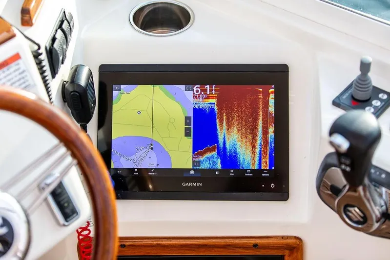 Given To Fly Yacht Photos Pics Garmin navigation display on 2021 Hunt Yachts Harrier 26 dashboard, featuring sonar and map.